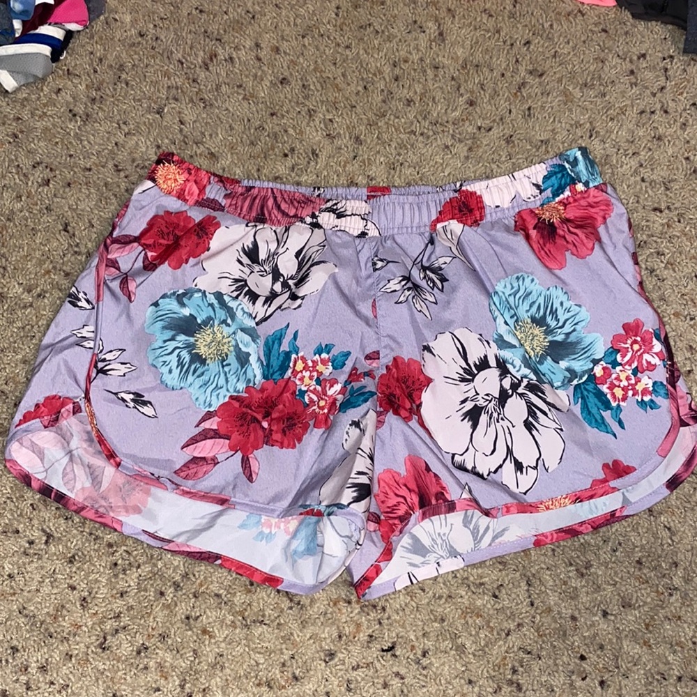 Purple floral athletic shorts. Lined. Waistband. Drawstring.